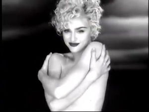 Madonna sans bra but stashing her
